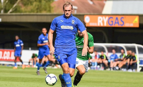 James Hanson gjorde sin debut för Wimbledon i mötet med Brighton hemma på Kingsmeadow.